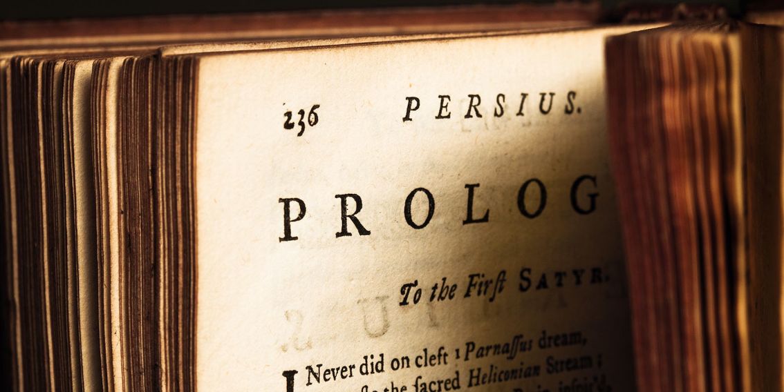 Photo of an old book, cropped to display the word 'prologue'.